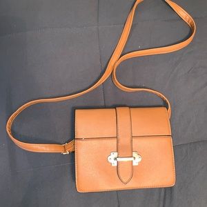 Brown crossbody purse.